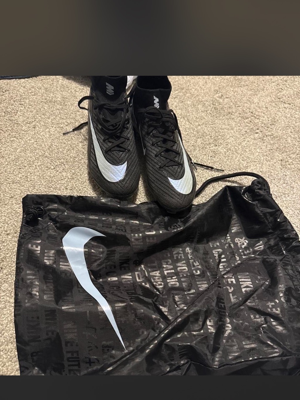 Nike woman’s Gen 4 black and light blue soccer cleats size 6